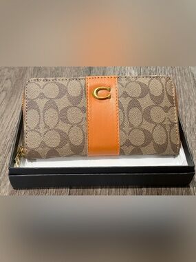 Brown Signature Canvas Wallet with Orange Leather Strap and Gold C